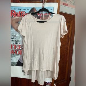 Light pink shirt. Cotton in front. Silk on back. Back is longer than front